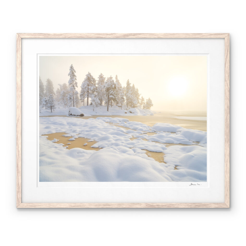 A Signed Art Print with the light breaking through the mist in a frozen winter landscape in Hotagens Nature Reserve, Jämtland.